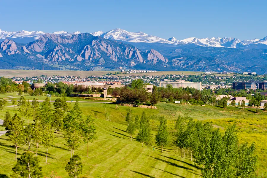 Interlocken Business Park with a housing development in the background in Broomfield, Colorado, near Boulder and the Rocky Mountains.